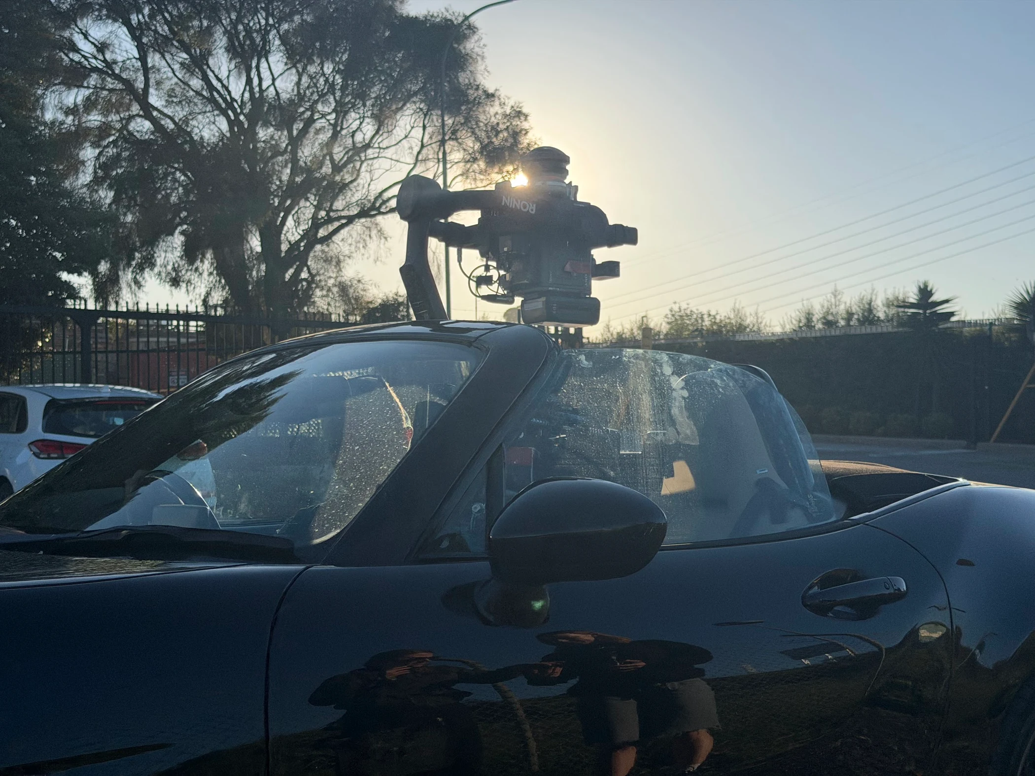 A stabilised cinema camera mounted above a vehicle for Oscar’s driving-plate capture work.